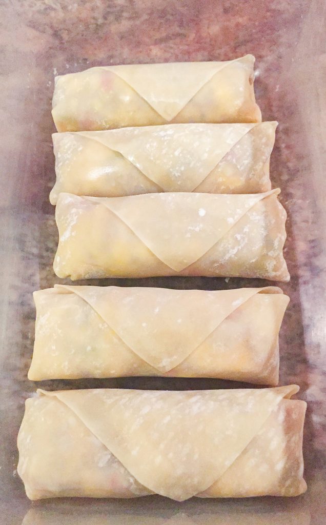 Ackee and saltfish spring rolls ready to be fried